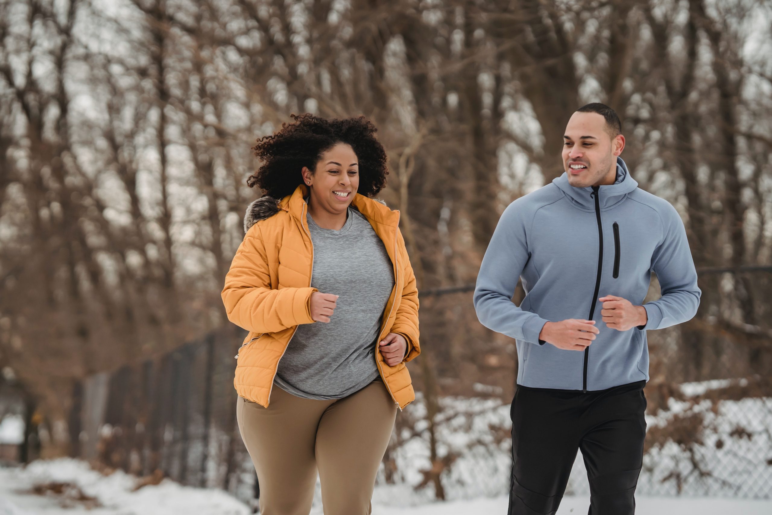 A woman and a man jogging. Photo by Julia Larson on Pexels.com