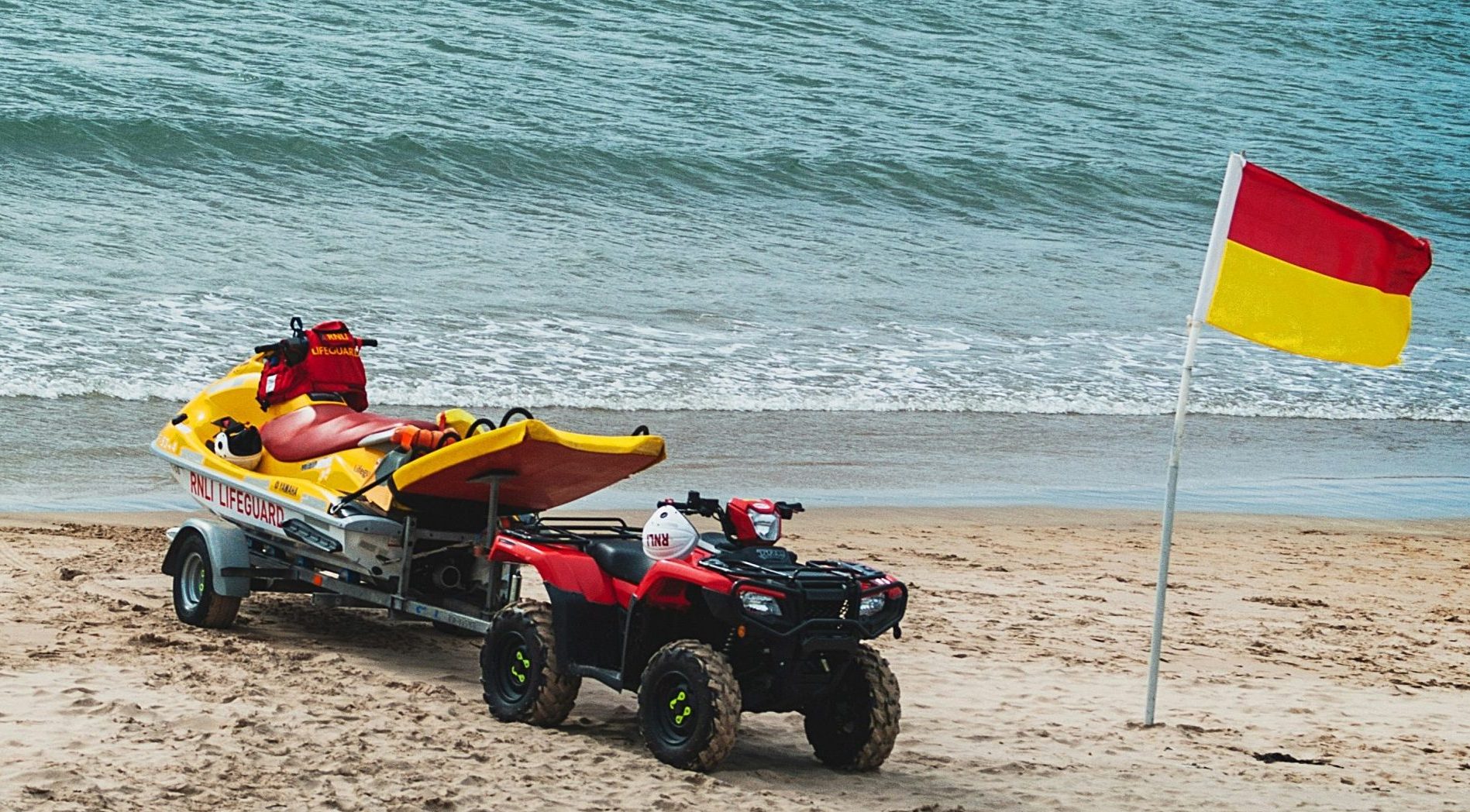 RNLI lifeguard vehicles. Photo by K. Mitch Hodge on Unplash.com