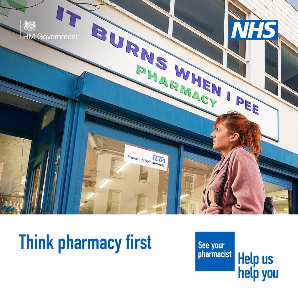 A person is standing outside a pharmacy looking uncomfortable. The sign above the pharmacy reads 'It burns when I pee pharmacy'

 A lower third box features in the bottom on the image. Text in the box reads: 'Think pharmacy first'