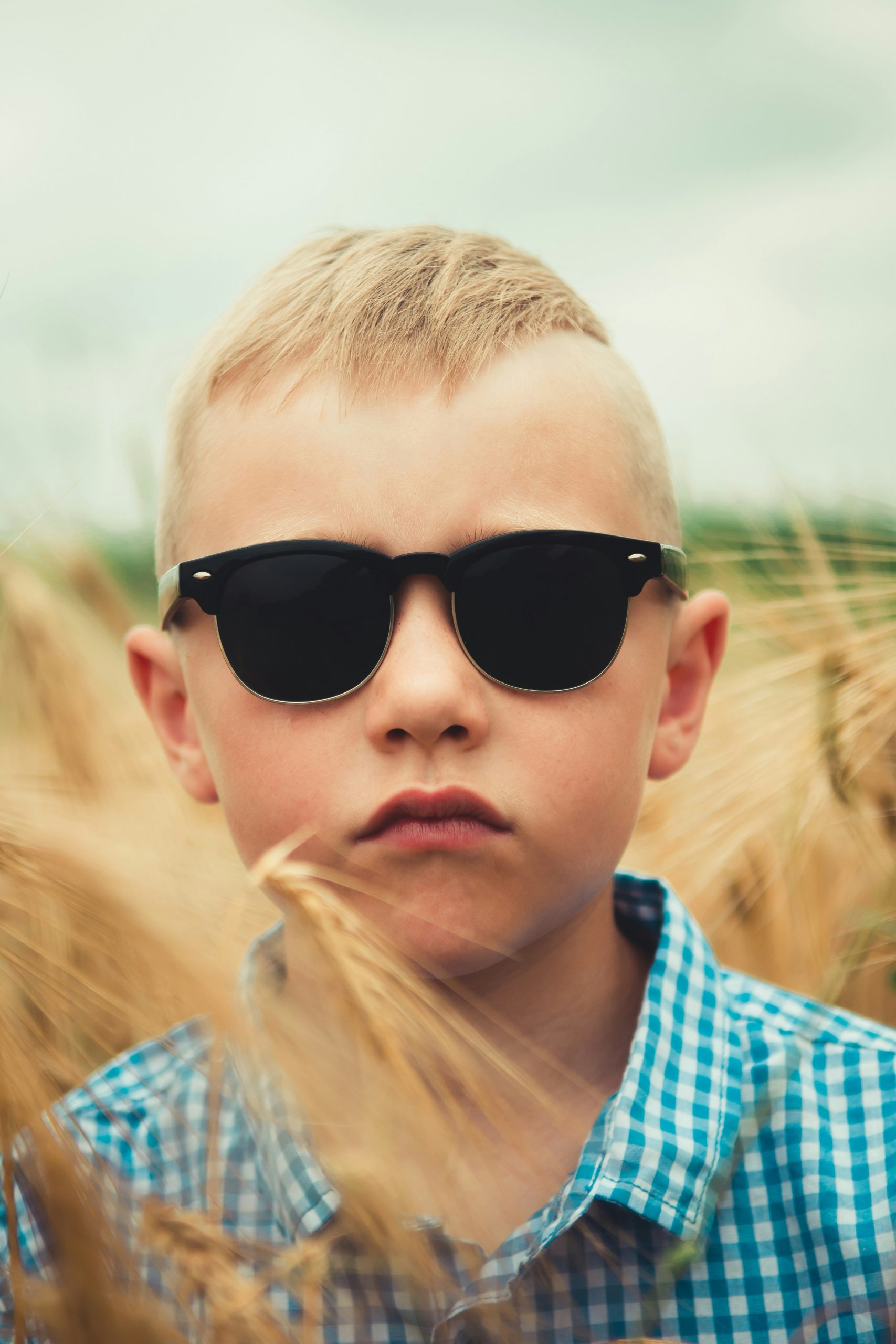 A boy in sunglass. Photo by Andriyko Podilnyk on Unsplash.com